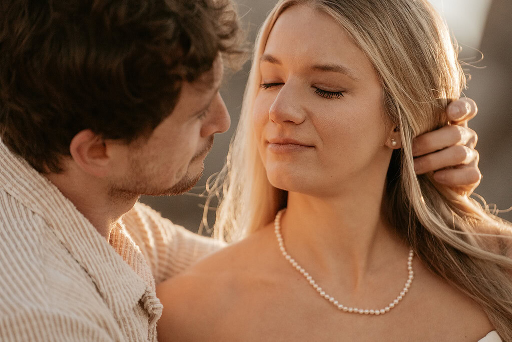 Couple sharing a tender, intimate moment together.