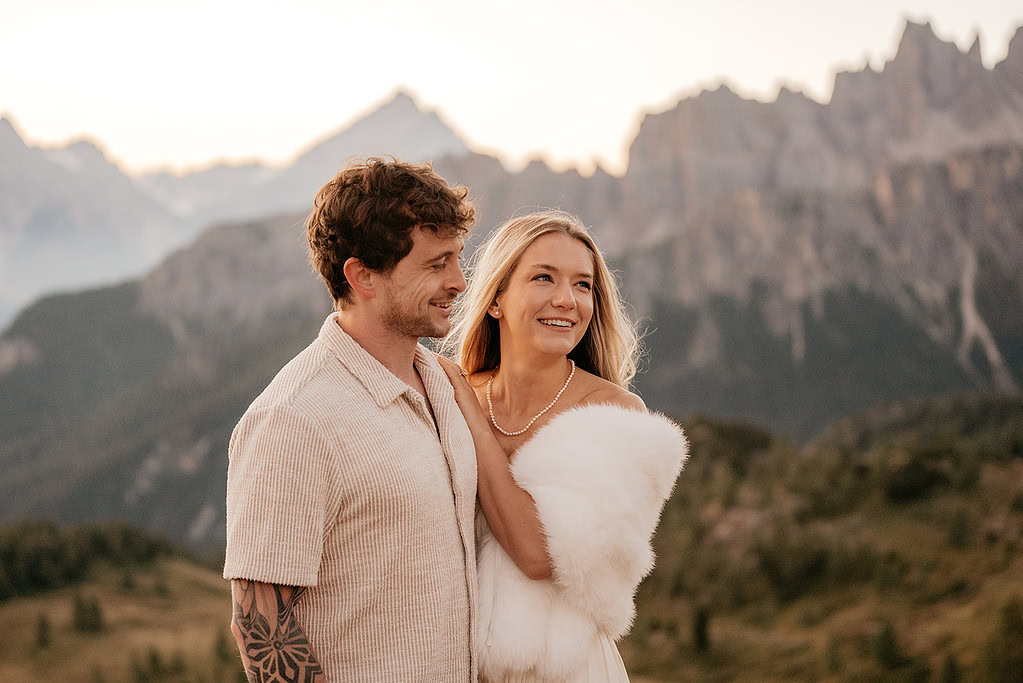 Couple enjoying mountain view during sunset