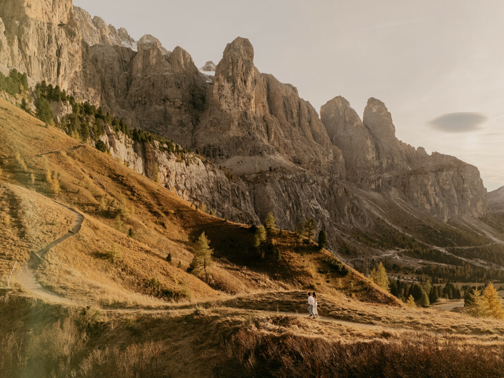 Hiker on path with mountainous landscape