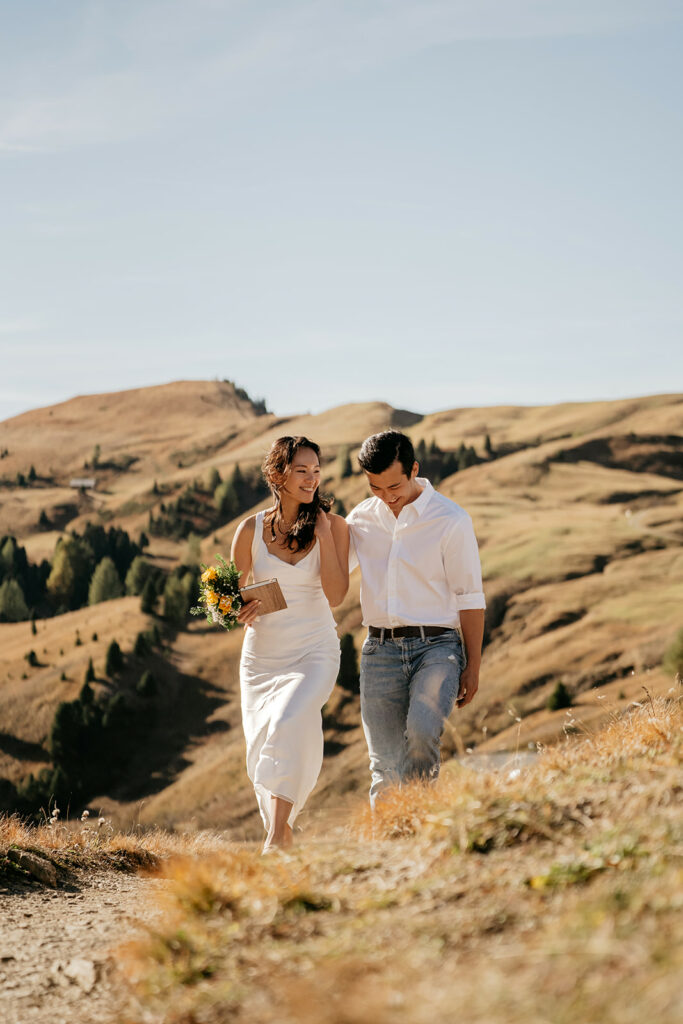 Couple walking in scenic mountain landscape