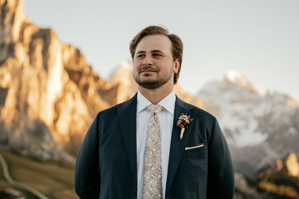 Man in suit with mountain backdrop