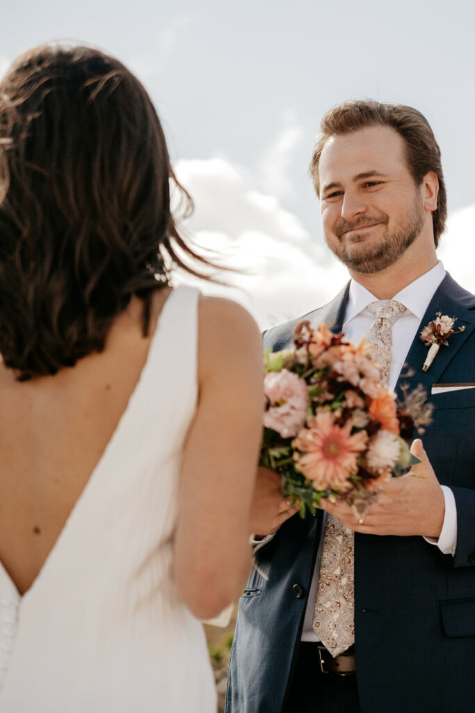 Bride and groom exchanging vows at wedding.