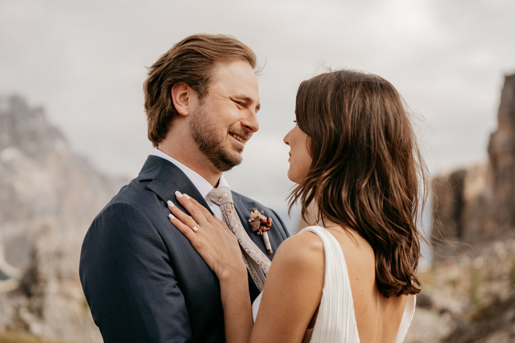 Couple embracing outdoors with scenic backdrop