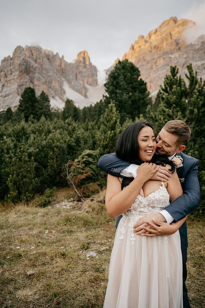 Couple embracing in scenic mountain landscape