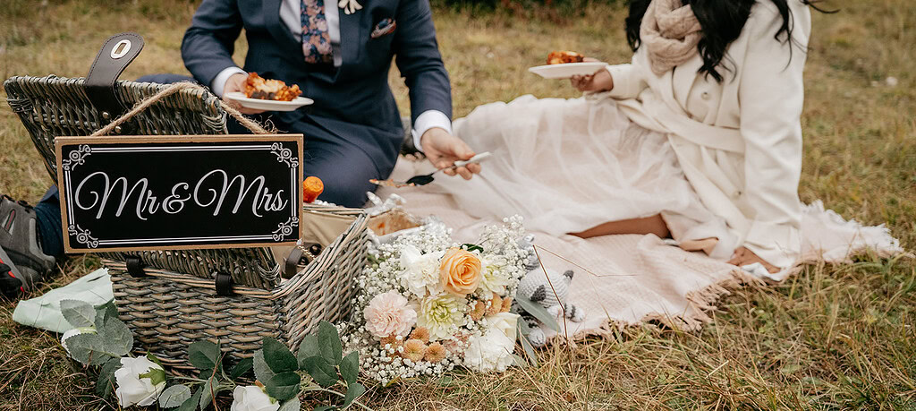 Couple picnic with Mr. & Mrs. sign