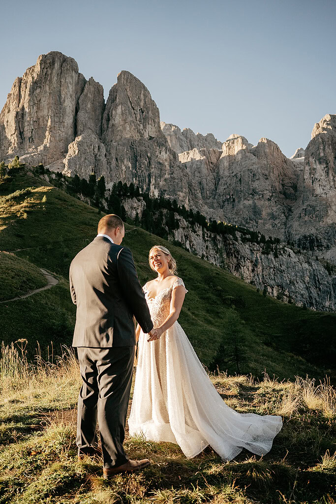 Couple getting married in scenic mountainous landscape.